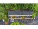 Aerial view of townhome community surrounded by lush trees with designated parking spots at 5929 Quail Hollow Rd # B, Charlotte, NC 28210