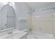 Bright bathroom featuring a single sink vanity, decorative mirror, and a shower-tub combination at 5929 Quail Hollow Rd # B, Charlotte, NC 28210