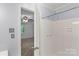 Bathroom featuring white shower, and a view into the adjacent bedroom at 5929 Quail Hollow Rd # B, Charlotte, NC 28210
