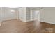 Dining room featuring wood floors, built-in shelving, chandelier, and neutral paint at 5929 Quail Hollow Rd # B, Charlotte, NC 28210