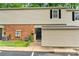 Exterior view of a townhome with siding, small front yard, and a parking spot at 5929 Quail Hollow Rd # B, Charlotte, NC 28210
