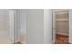 Hallway with view into bathroom and bedroom, with adjacent closet at 5929 Quail Hollow Rd # B, Charlotte, NC 28210