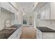 Updated kitchen with sleek countertops, modern fixtures, and white cabinets at 5929 Quail Hollow Rd # B, Charlotte, NC 28210