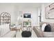 Bright and airy living room with a neutral color palette and comfortable seating at 606 York Ave, Statesville, NC 28677