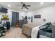 Bedroom featuring decor, guitar and dresser, with a ceiling fan and window for natural light at 65 Franklin St, Wadesboro, NC 28170