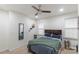 Comfortable bedroom with a ceiling fan, mirror, and decor at 65 Franklin St, Wadesboro, NC 28170