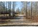 Long gravel driveway leading to a detached garage at 665 Edwards Rd, Fort Lawn, SC 29714