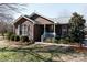 Brick ranch house with landscaped yard and teal front door at 665 Edwards Rd, Fort Lawn, SC 29714