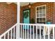 Inviting front porch with teal door and white railing at 665 Edwards Rd, Fort Lawn, SC 29714