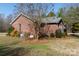 Side view of brick ranch house with mature trees at 665 Edwards Rd, Fort Lawn, SC 29714