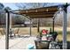 Covered deck patio with pergola, seating, and string lights at 665 Edwards Rd, Fort Lawn, SC 29714