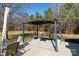 Relaxing seating area on deck under pergola with string lights at 665 Edwards Rd, Fort Lawn, SC 29714