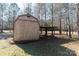 Wooden storage shed with metal roof and covered side at 665 Edwards Rd, Fort Lawn, SC 29714