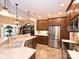 Kitchen featuring stainless steel appliances, tile backsplash, and an opening to the dining area at 9038 Elrose Pl, Charlotte, NC 28277