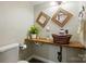 Unique powder room featuring a copper sink, rustic wood counter, and ornate mirrors at 9108 Nolley Ct # B, Charlotte, NC 28270