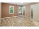 Bright bedroom featuring hardwood floors, neutral walls, walk-in closet, and natural lighting at 9108 Nolley Ct # B, Charlotte, NC 28270
