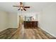 Open-concept living room featuring wood-look floors and seamless flow to the kitchen at 9108 Nolley Ct # B, Charlotte, NC 28270