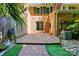 Back patio with brick pavers, fenced in yard, and professional landscaping at 9108 Nolley Ct # B, Charlotte, NC 28270