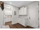 Bright laundry room with white cabinets and washer/dryer set at 9635 Andres Duany Dr, Huntersville, NC 28078