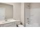 Clean bathroom with white vanity, bathtub, and shower at 9834 Old Garden Cir, Gastonia, NC 28056