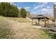 Spacious backyard featuring a charming gazebo with seating area, perfect for outdoor relaxation at 101 Arbridge Ct, Mount Holly, NC 28120