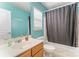 Bright bathroom features a single sink vanity and shower-tub combo at 101 Arbridge Ct, Mount Holly, NC 28120