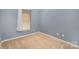 Empty bedroom shows neutral walls and carpeting, window with blinds at 101 Arbridge Ct, Mount Holly, NC 28120