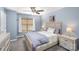 Comfortable bedroom featuring a ceiling fan, neutral walls, and natural light from the window at 101 Arbridge Ct, Mount Holly, NC 28120