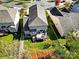 Aerial view of a well-maintained home featuring a spacious backyard and wooden deck at 10120 Garman Hill Dr, Charlotte, NC 28214