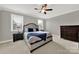 Serene primary bedroom with a large bed, side tables, lamps, and a dark wood dresser at 10120 Garman Hill Dr, Charlotte, NC 28214