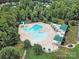 Aerial image showcasing a community pool with ample seating and a slide for residents' enjoyment at 10120 Garman Hill Dr, Charlotte, NC 28214