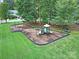 Aerial view of a community playground with swings, slides, and green space at 10120 Garman Hill Dr, Charlotte, NC 28214