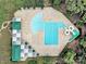 Overhead view of a community pool with a water slide, lap lanes, and lounge areas with umbrellas at 10120 Garman Hill Dr, Charlotte, NC 28214