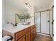 Bathroom with double vanity, large mirror, and walk-in shower at 1018 Archibald Ave, Fort Mill, SC 29708