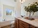 Main bathroom with double vanity and soaking tub at 1018 Archibald Ave, Fort Mill, SC 29708