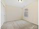 Spacious bedroom with neutral walls, carpet, and window at 1018 Archibald Ave, Fort Mill, SC 29708