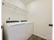 Laundry room with washer, dryer, and overhead shelving at 1018 Archibald Ave, Fort Mill, SC 29708