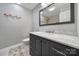 Bathroom featuring a sleek vanity with marble countertop and a mirror reflecting the tiled shower at 1019 Palmyra Dr, Fort Mill, SC 29708