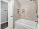 Bright bathroom featuring tiled walls and a large tub with jets at 1019 Palmyra Dr, Fort Mill, SC 29708