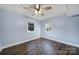 Bright bedroom featuring hardwood floors, neutral paint, and natural light at 1019 Palmyra Dr, Fort Mill, SC 29708