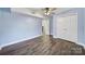 Cozy bedroom featuring hardwood floors, neutral paint, and a closet at 1019 Palmyra Dr, Fort Mill, SC 29708