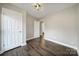 Bedroom featuring hardwood floors, neutral walls, and bright white doors and trim at 1019 Palmyra Dr, Fort Mill, SC 29708