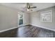 Bedroom with hardwood floors, two windows for natural light, and a ceiling fan at 1019 Palmyra Dr, Fort Mill, SC 29708