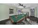 Entertaining game room with a billiard table, kitchenette, and storage cabinets at 1019 Palmyra Dr, Fort Mill, SC 29708