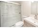 Bathroom featuring glass shower doors, a modern sink, and sleek fixtures at 10718 Downpatrick Pl, Charlotte, NC 28262