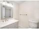 Bathroom featuring a modern sink, vanity, and updated fixtures at 10718 Downpatrick Pl, Charlotte, NC 28262