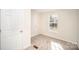 Bedroom featuring a closet, window, and neutral carpet at 10718 Downpatrick Pl, Charlotte, NC 28262