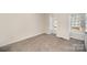 Bedroom with carpeting and natural lighting at 10718 Downpatrick Pl, Charlotte, NC 28262