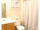 Bathroom with white fixtures, shower and flower decorations at 10946 Garden Oaks Ln, Charlotte, NC 28273