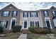 Brick front exterior of charming townhome with landscaping at 10946 Garden Oaks Ln, Charlotte, NC 28273